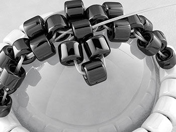 Threading on a new set of three black beads 